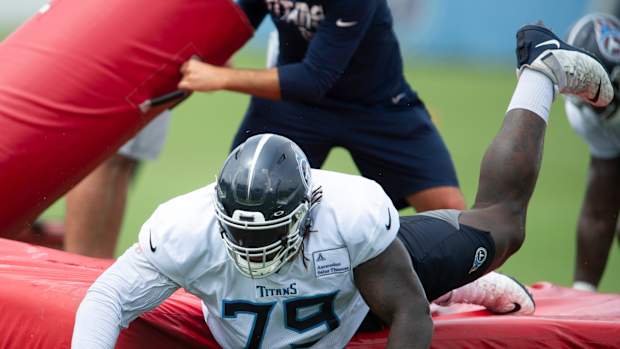 Tennessee Titans tackle Isaiah Wilson (79) slides off a pad during tackling drills at practice at Saint Thomas Sports Park Monday, Aug. 31, 2020 Nashville, Tenn.
